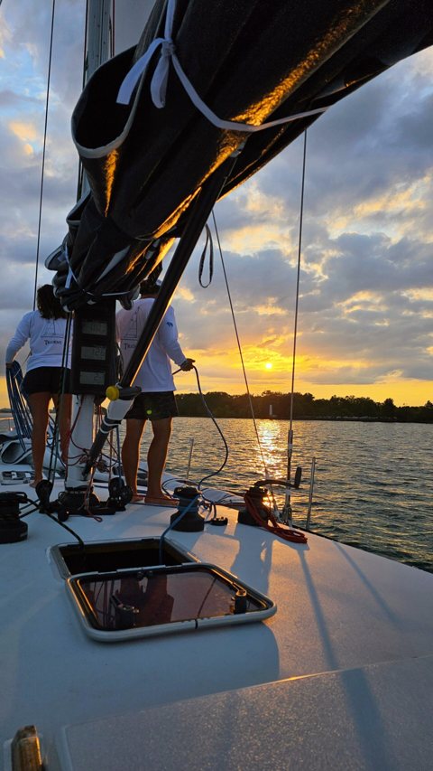 Detroit Charter Company: HYDRA sailing at sunset on the Detroit River