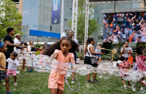 Downtown Detroit Partnership: Families at a Campus Kids Day event in Campus Martius Park