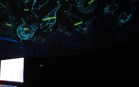 Wayne State University Planetarium: Presenter explaining the night sky under the dome