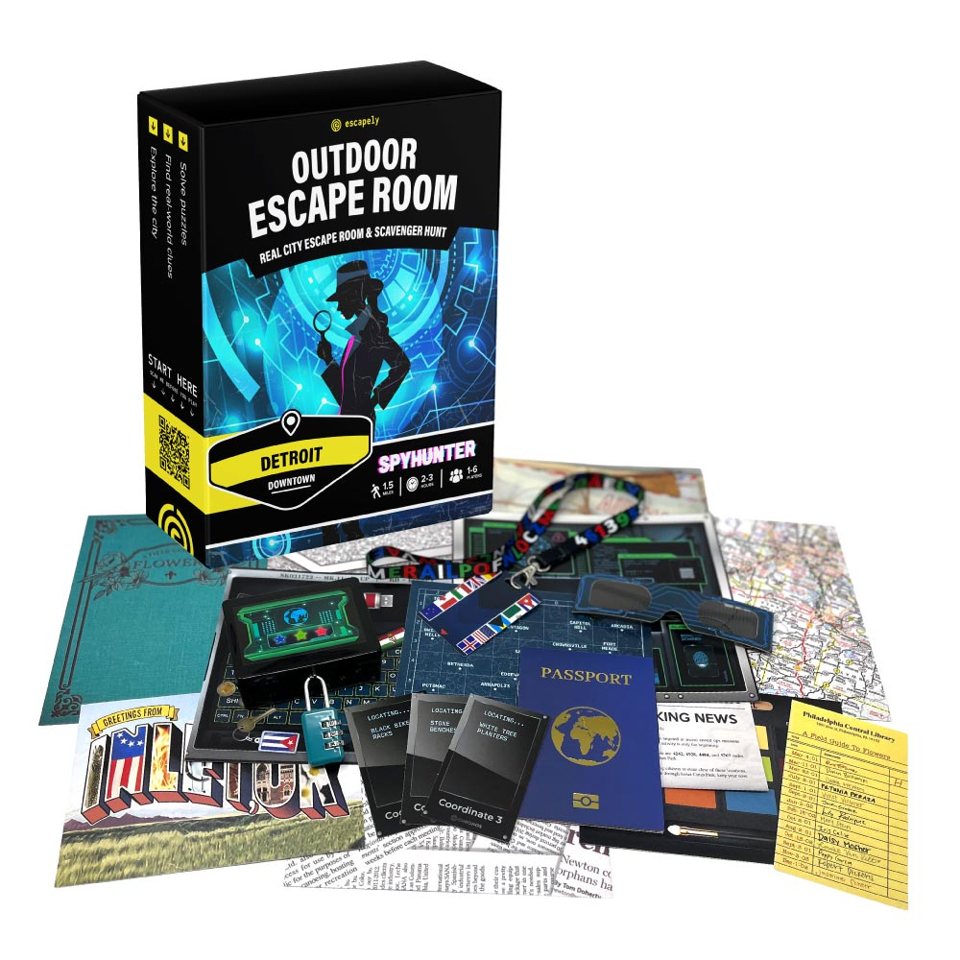 The Spyhunter Detroit outdoor escape game kit with its box, maps, passport, lanyard, clue cards and padlock