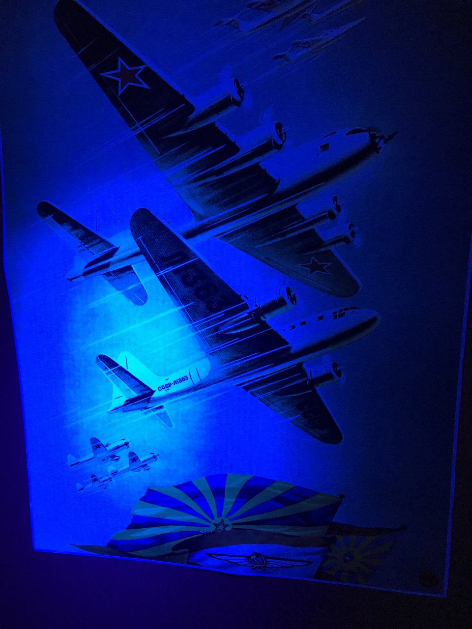 Poster of Soviet bomber planes glowing under ultraviolet light