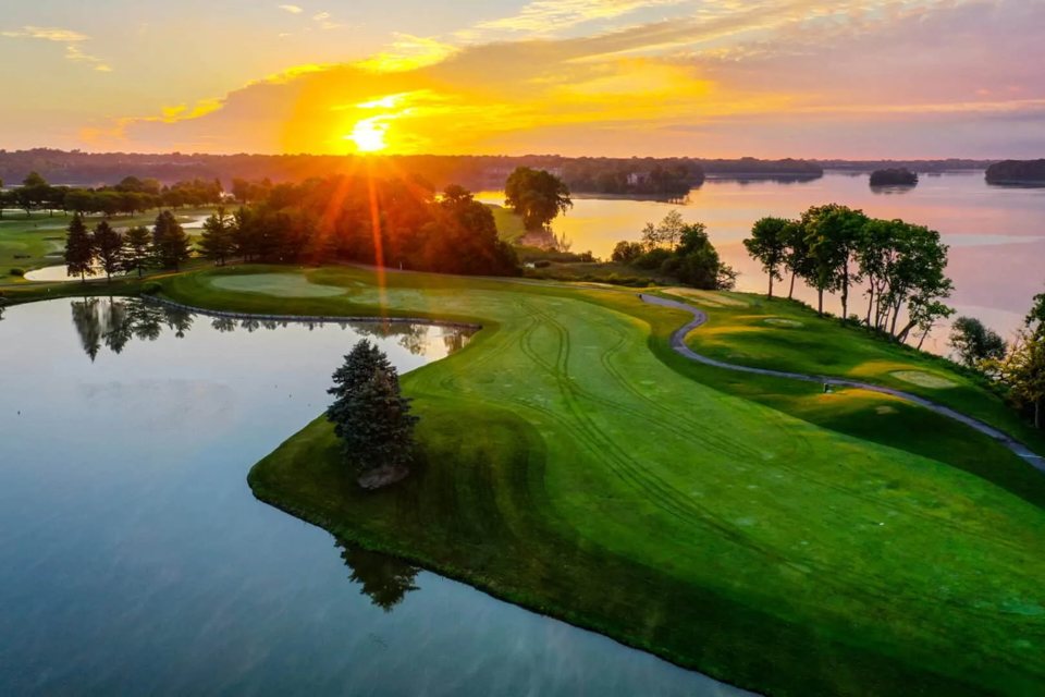 Aerial view of the Eagle Crest golf course and Ford Lake with the sun low on the horizon