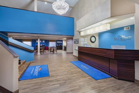 The front desk with a blue floor mat