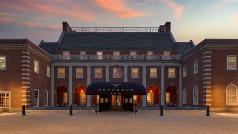 The main building's lit entrance at dusk