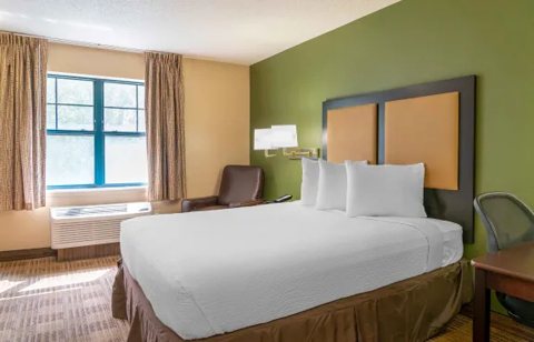 A room with a bed and a window
