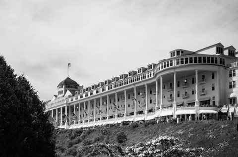 The hotel's long porch and cupola in a black-and-white photo