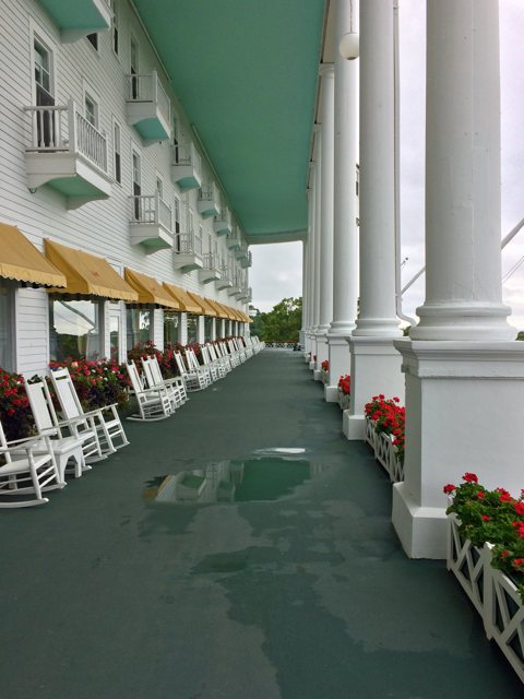 The famous front porch with white columns and rocking chairs