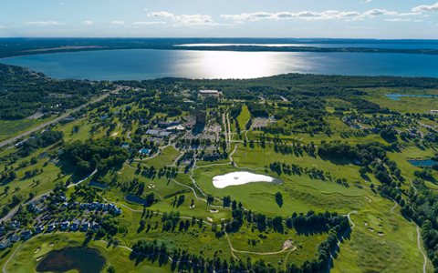 Aerial view of the resort, its golf courses and Grand Traverse Bay