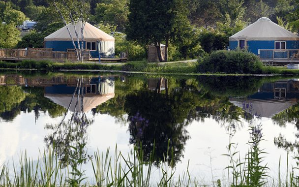 A lake view with park buildings and trees