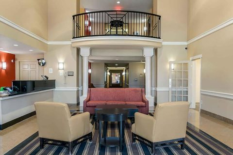 The lobby with seating and an upper-level balcony