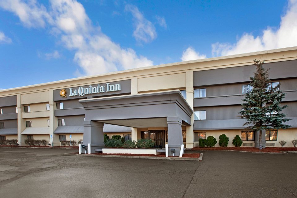 The La Quinta Inn's signed entrance canopy and building by day