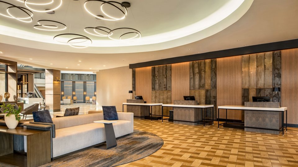 The hotel lobby with the front desk and seating areas