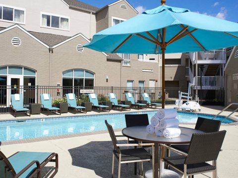 The courtyard pool with umbrella-shaded patio