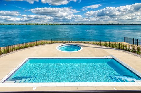 The hotel's outdoor pool and hot tub on the bank of the St. Clair River