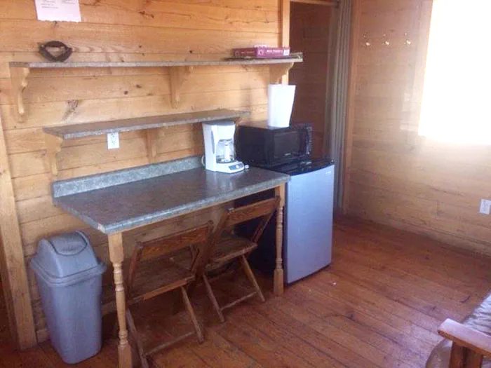 Cabin interior with a table and shelves
