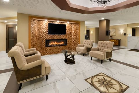 Lobby with a fireplace and armchairs