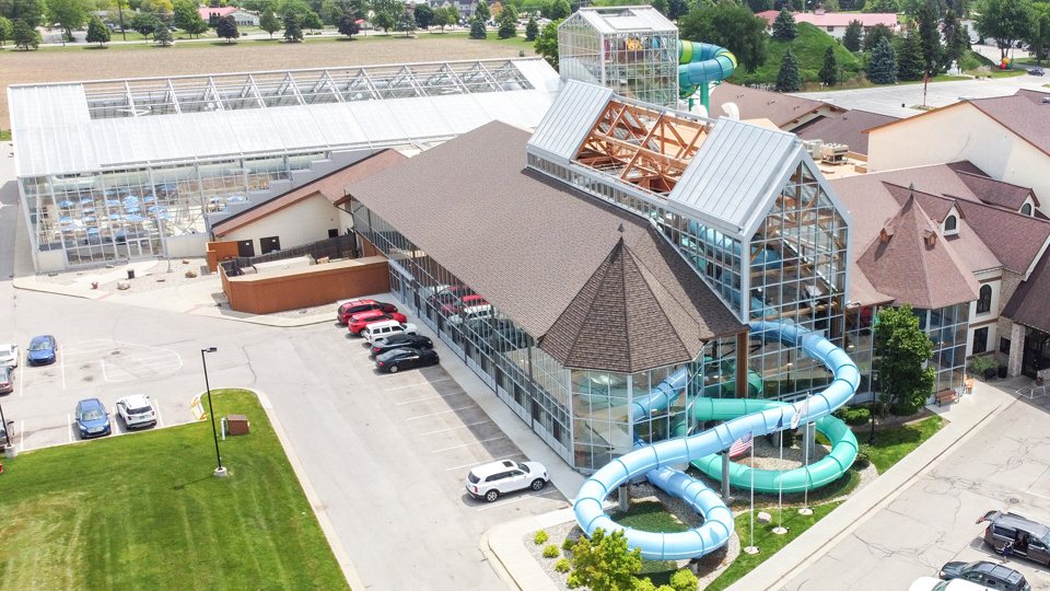 The hotel and waterpark buildings from above, with the outdoor slides