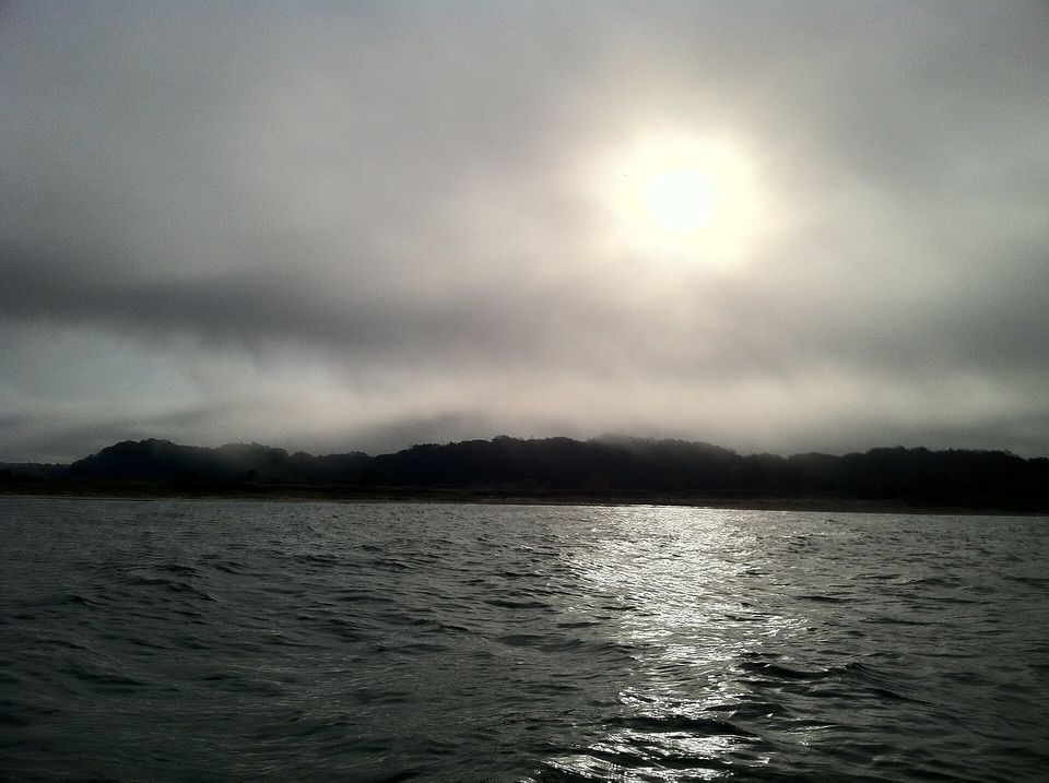 Late-October fog over the dunes and water at Oval Beach