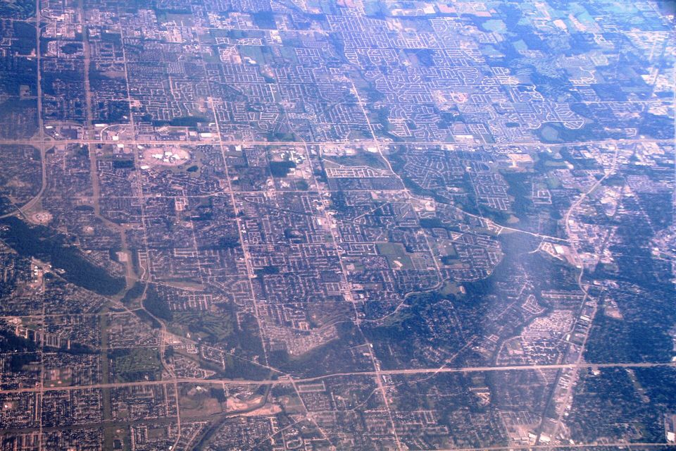 Macomb County suburbs and the winding Clinton River from the air