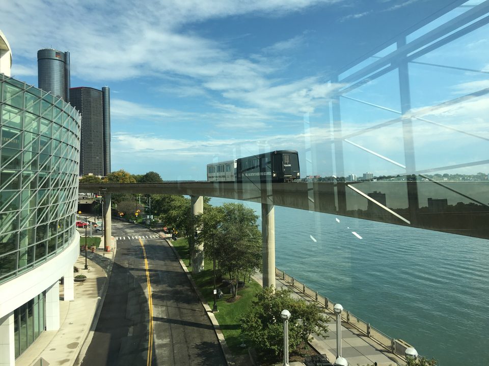 The river from the convention centre’s glass concourse, with a train on the guideway (2018)