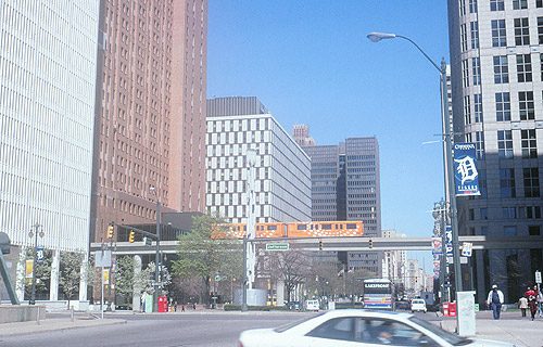 Cars in the original white livery with green and yellow stripes above Woodward Avenue, April 2000