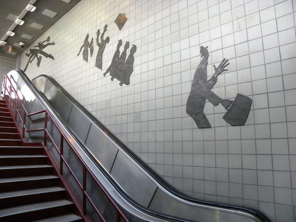 Kirk Newman’s “On the Move” beside the escalator (2009)