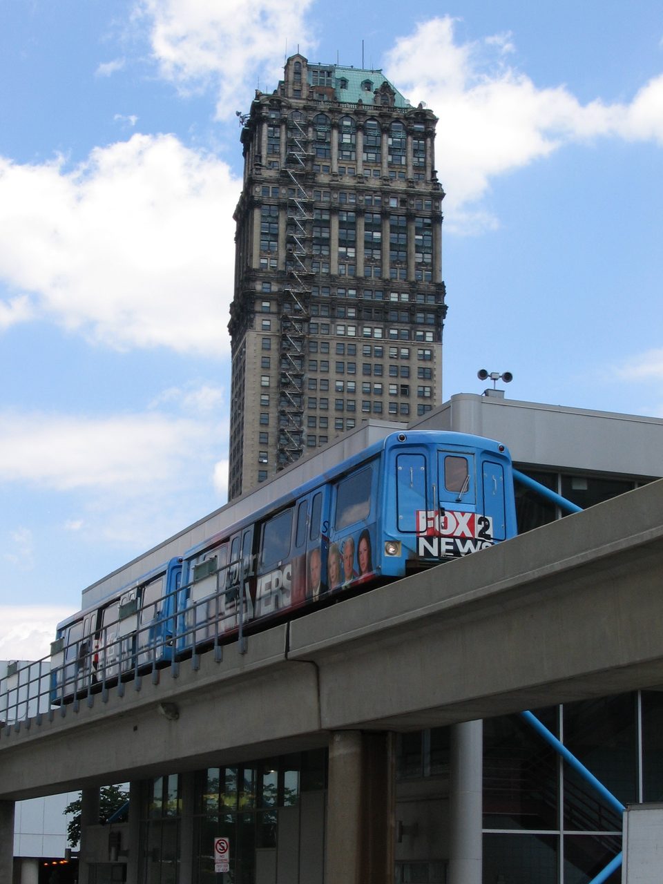 A train at Times Square station with the Book Tower behind (2008)