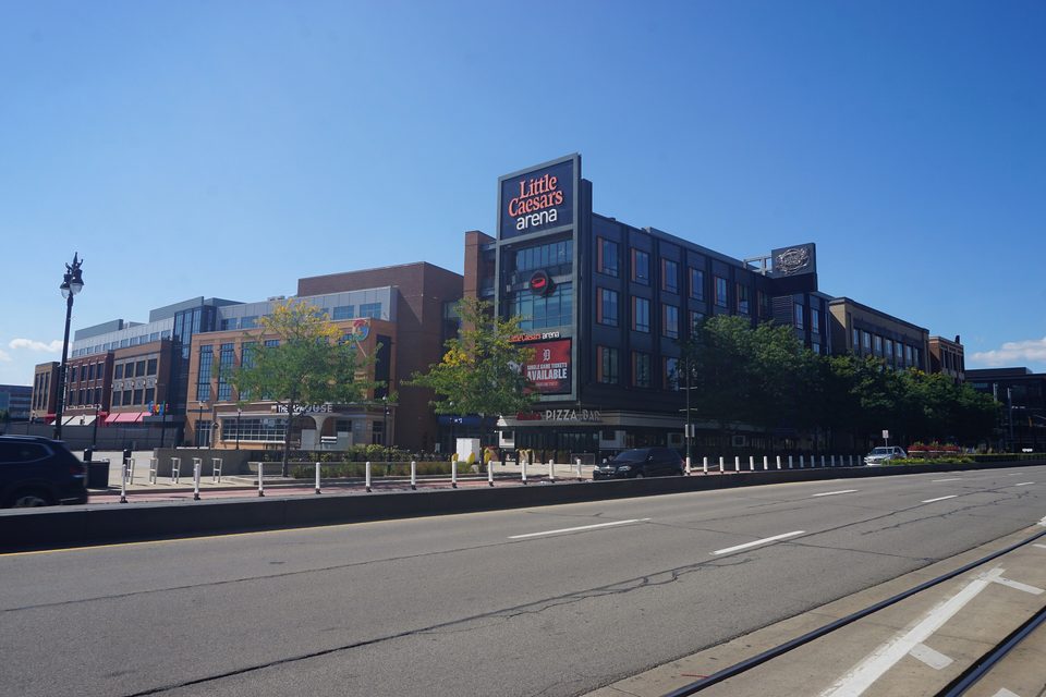 Little Caesars Arena from Woodward, with the QLINE tracks in front (2025)