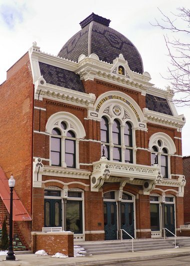 The opera house's ornate Victorian facade with its dome, arched windows and balcony