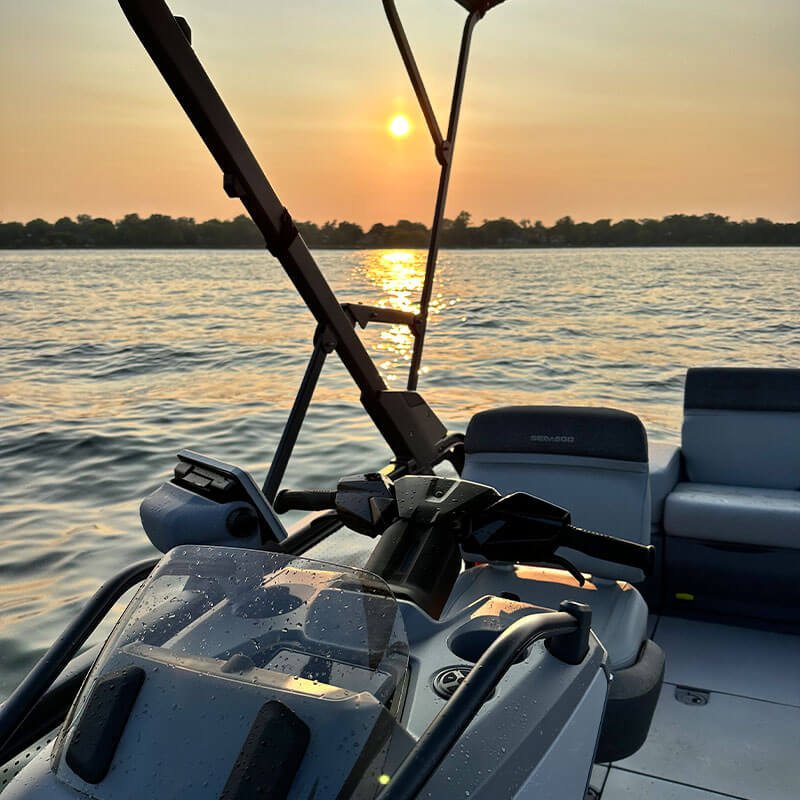 Sunset view from the jet boat's deck over the water