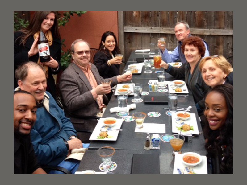 Guests raise a toast together during a shared dinner on a Detroit program