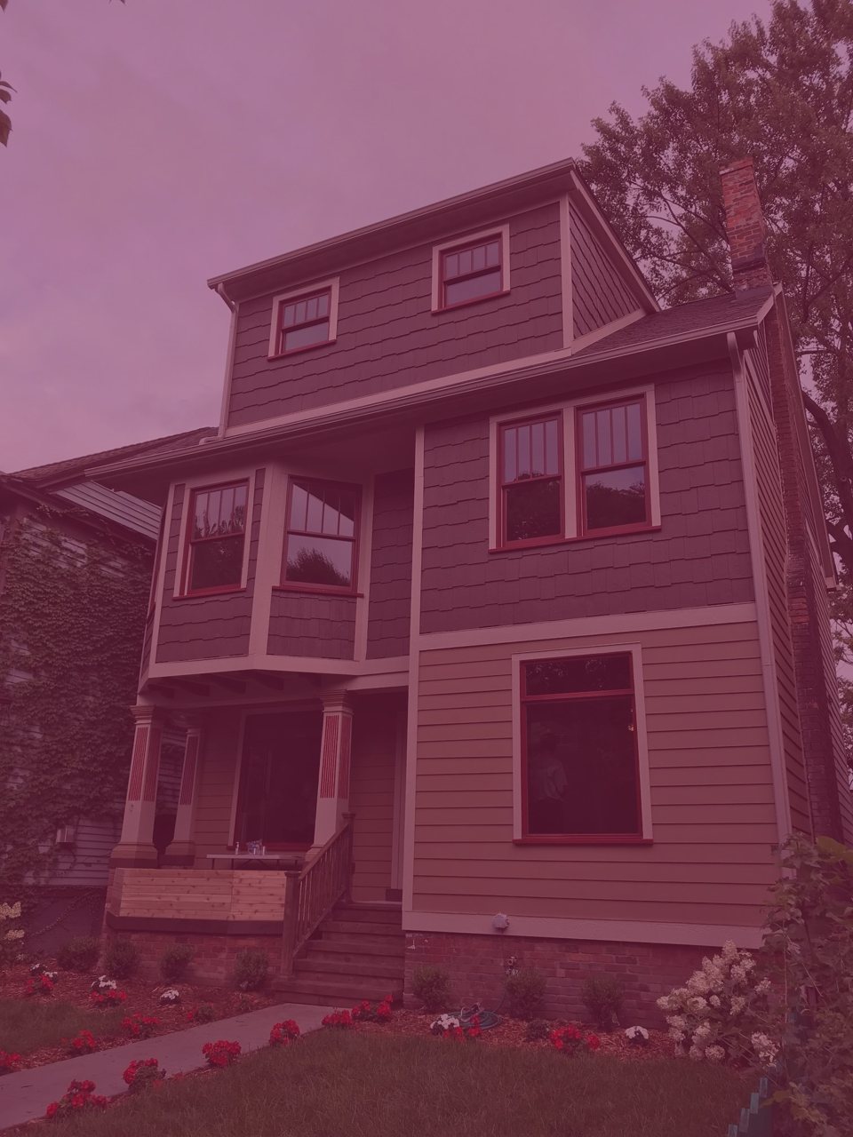 A renovated Victorian-style house in the Woodbridge neighborhood, shown in artistic color tones